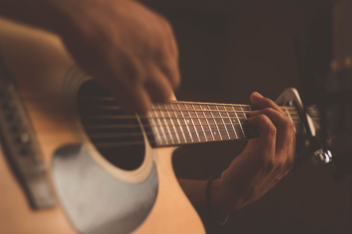 Photo by Jefferson Santos person playing guitar